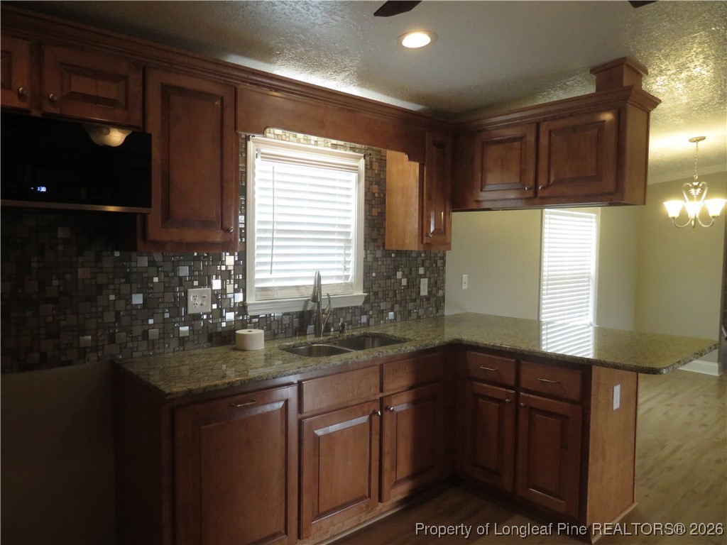 1184 Fisher Road St. Pauls, NC 28384 - Photo 10 of 29 a kitchen with sink and refrigerator