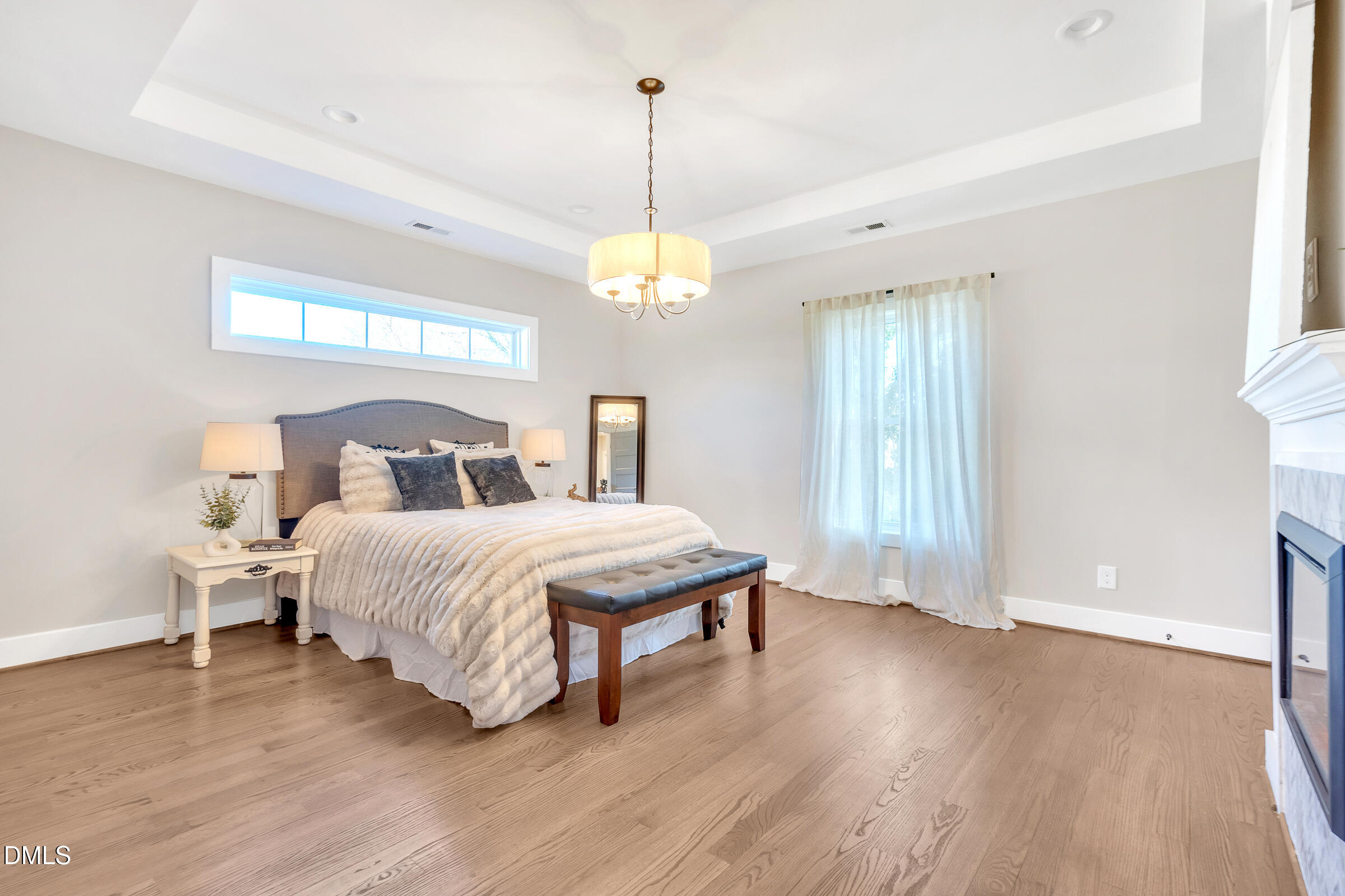 701 Eva Street Durham, NC 27701 - Photo 14 of 29 a bedroom with a bed and window