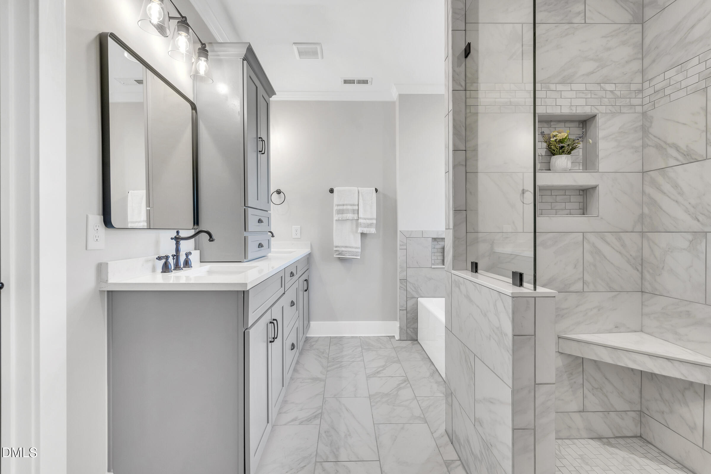 701 Eva Street Durham, NC 27701 - Photo 15 of 29 a bathroom with a double vanity sink mirror and shower