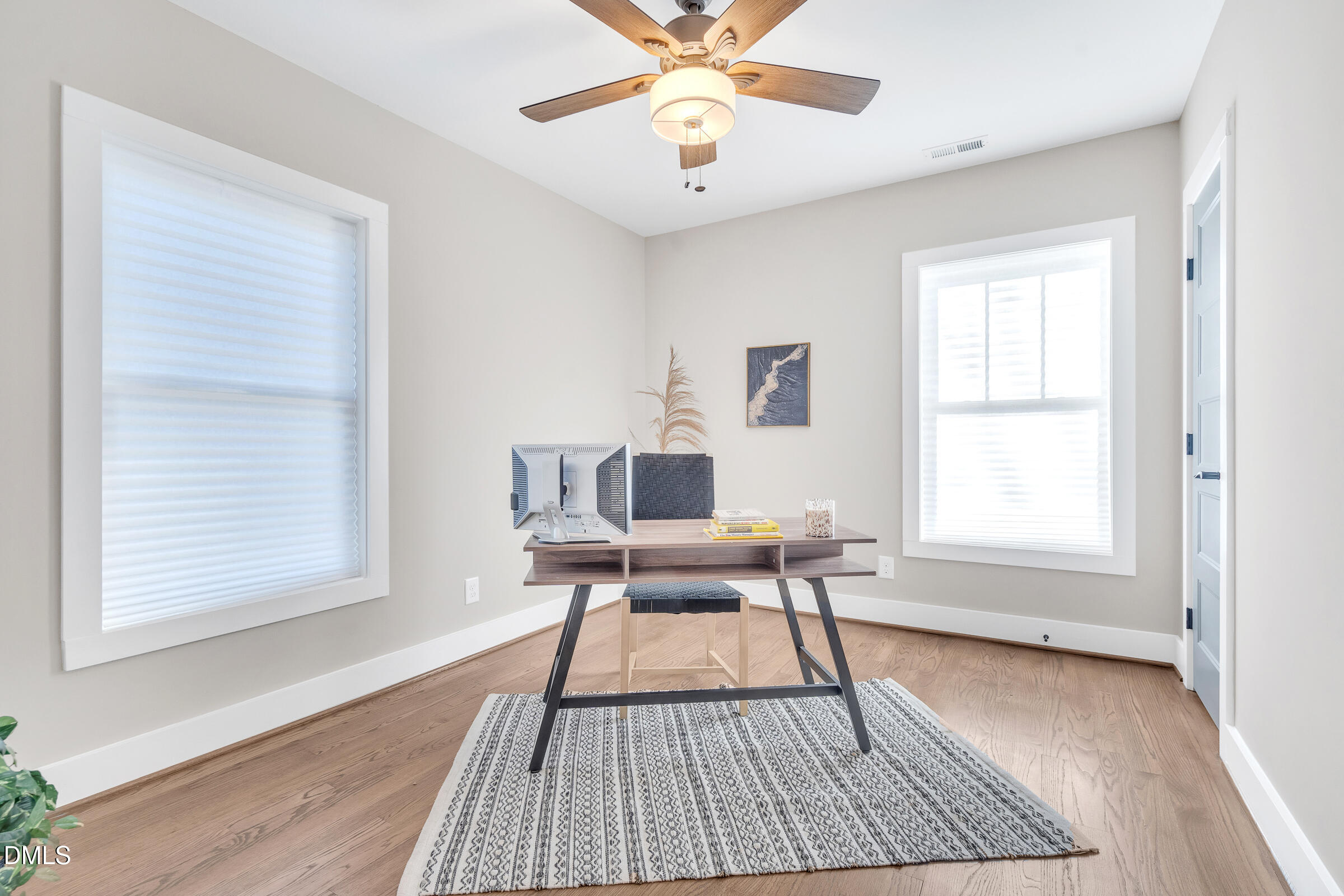 701 Eva Street Durham, NC 27701 - Photo 18 of 29 a work room with a window and wooden floor