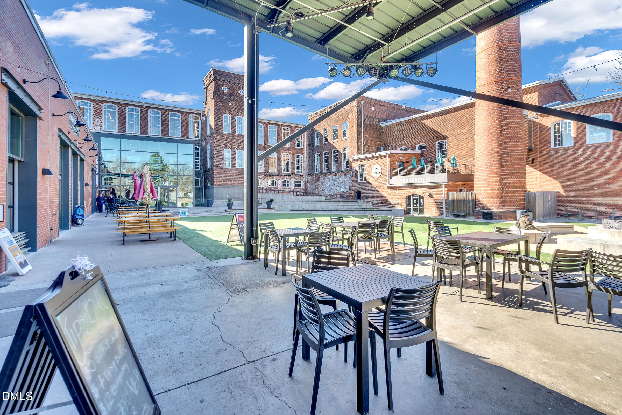 701 Eva Street Durham, NC 27701 - Photo 24 of 29 a view of a dining room with furniture and chandelier