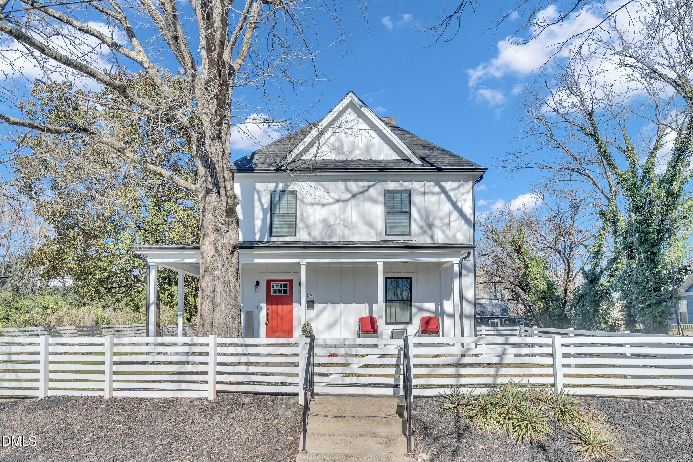 701 Eva Street Durham, NC 27701 - Photo 2 of 29 a view of a house with a small yard and large tree
