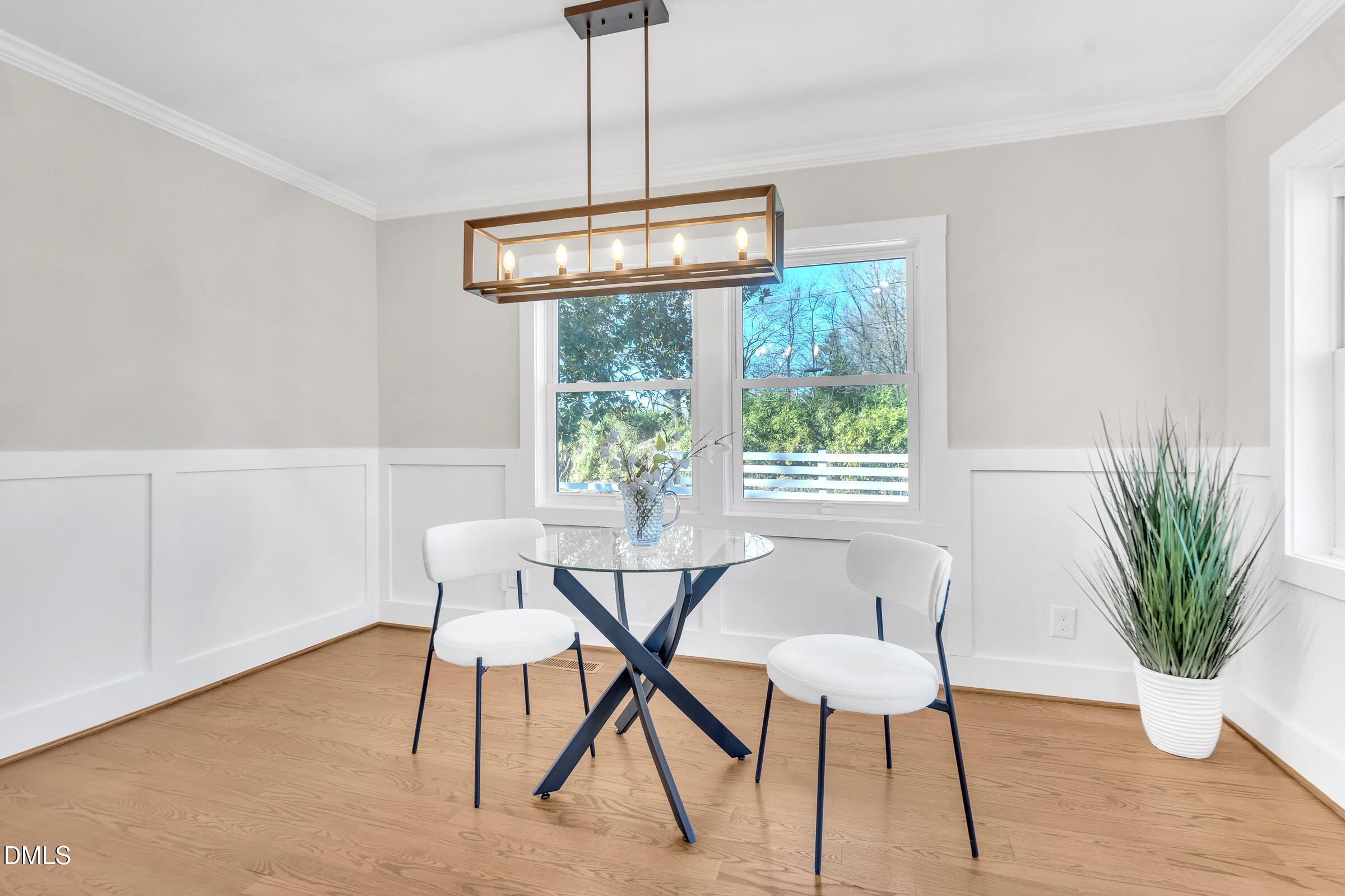 701 Eva Street Durham, NC 27701 - Photo 3 of 29 a view of a dining room with furniture window and wooden floor