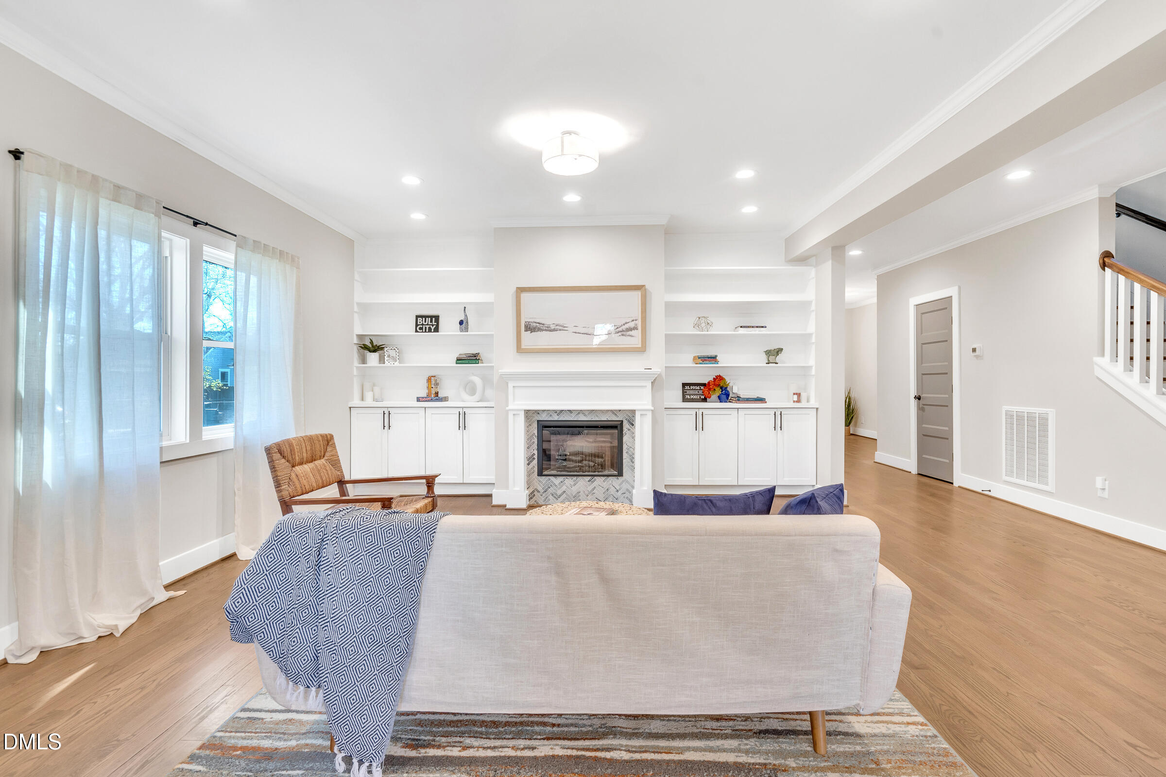 701 Eva Street Durham, NC 27701 - Photo 6 of 29 a living room with furniture and a fireplace