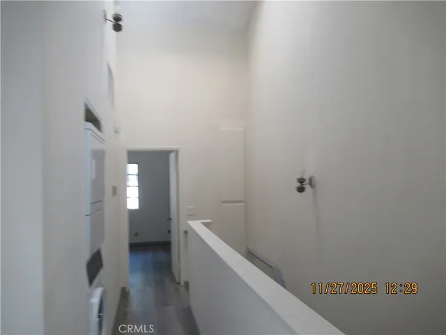 a view of a glass door and a tree