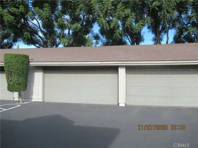 a kitchen with stainless steel appliances cabinets and wooden floor