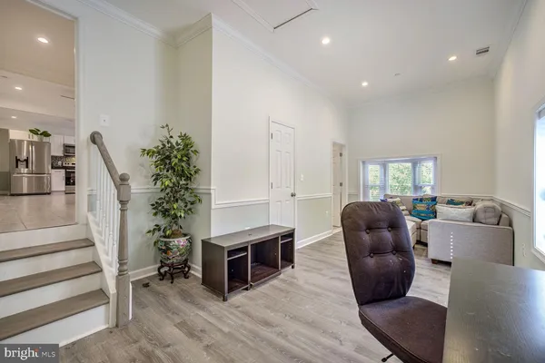 a living room with furniture potted plant and a fireplace