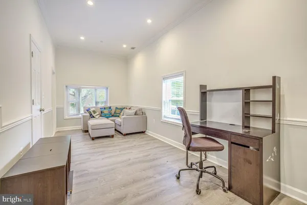 a living room with furniture a window and a table