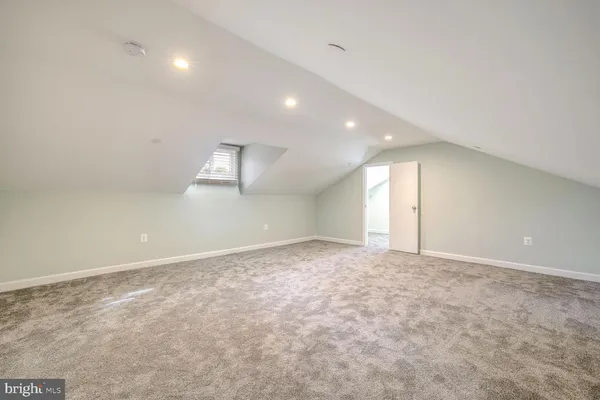 an empty room with a empty space and windows