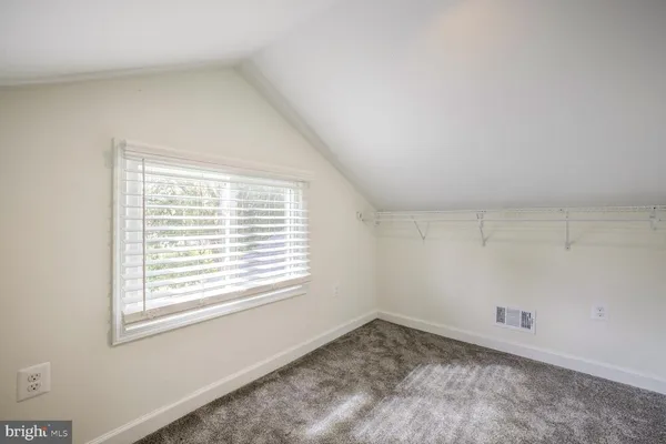 a view of a room that has a window in it