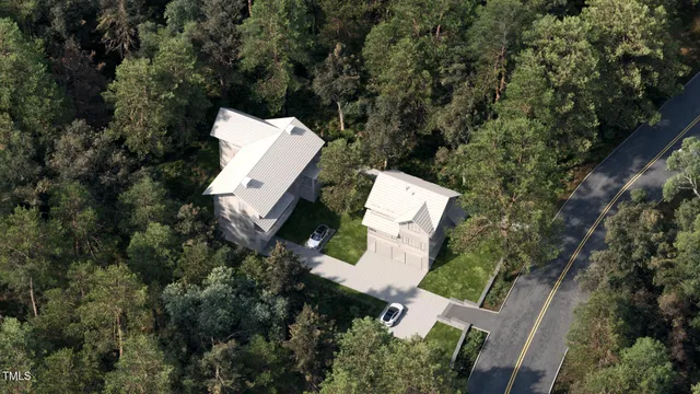 an aerial view of house with yard and outdoor seating