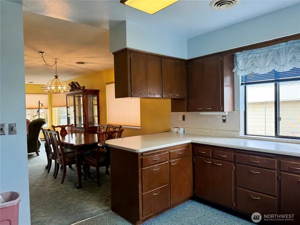 a kitchen with a sink and cabinets