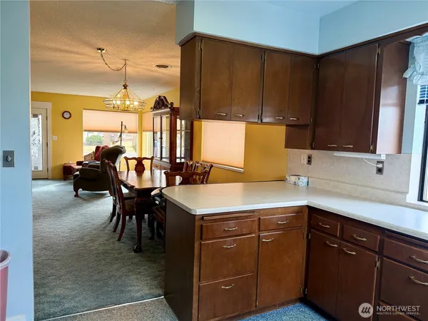 a kitchen with a sink cabinets and window