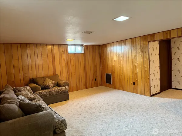 a livingroom with furniture and curtain