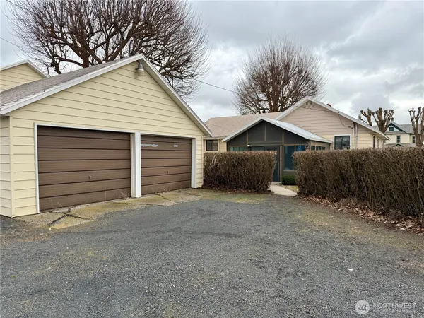 a house with a yard and garage