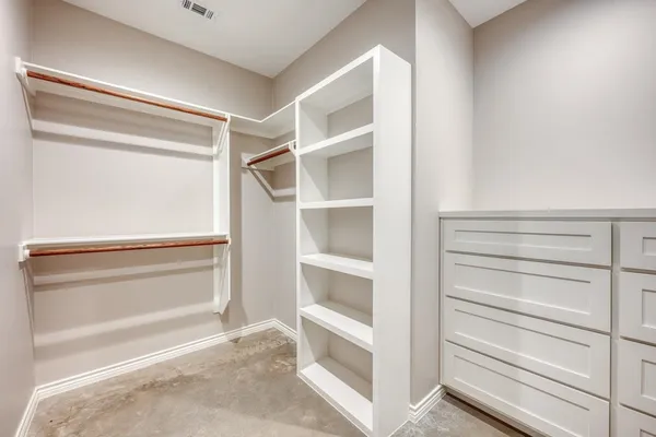 a view of an empty walk in closet