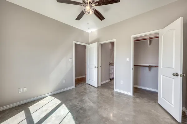 a view of entryway and hall with a ceiling fan