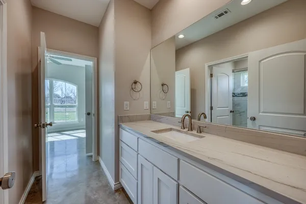 a bathroom with a sink and a mirror