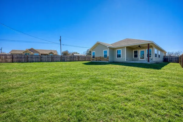 a view of a house with a big yard