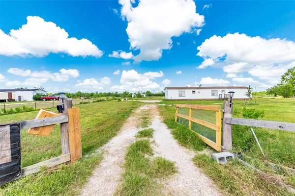 a view of a lake with a house in the background