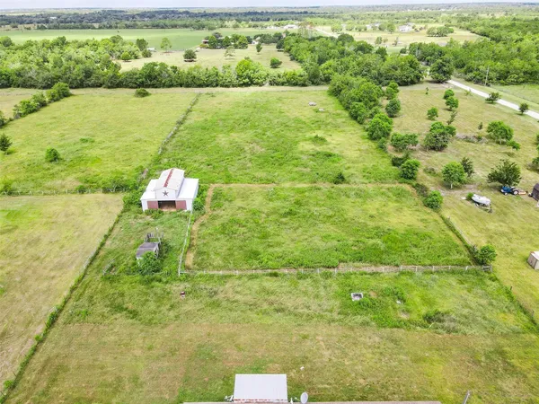 a view of a lake with a big yard