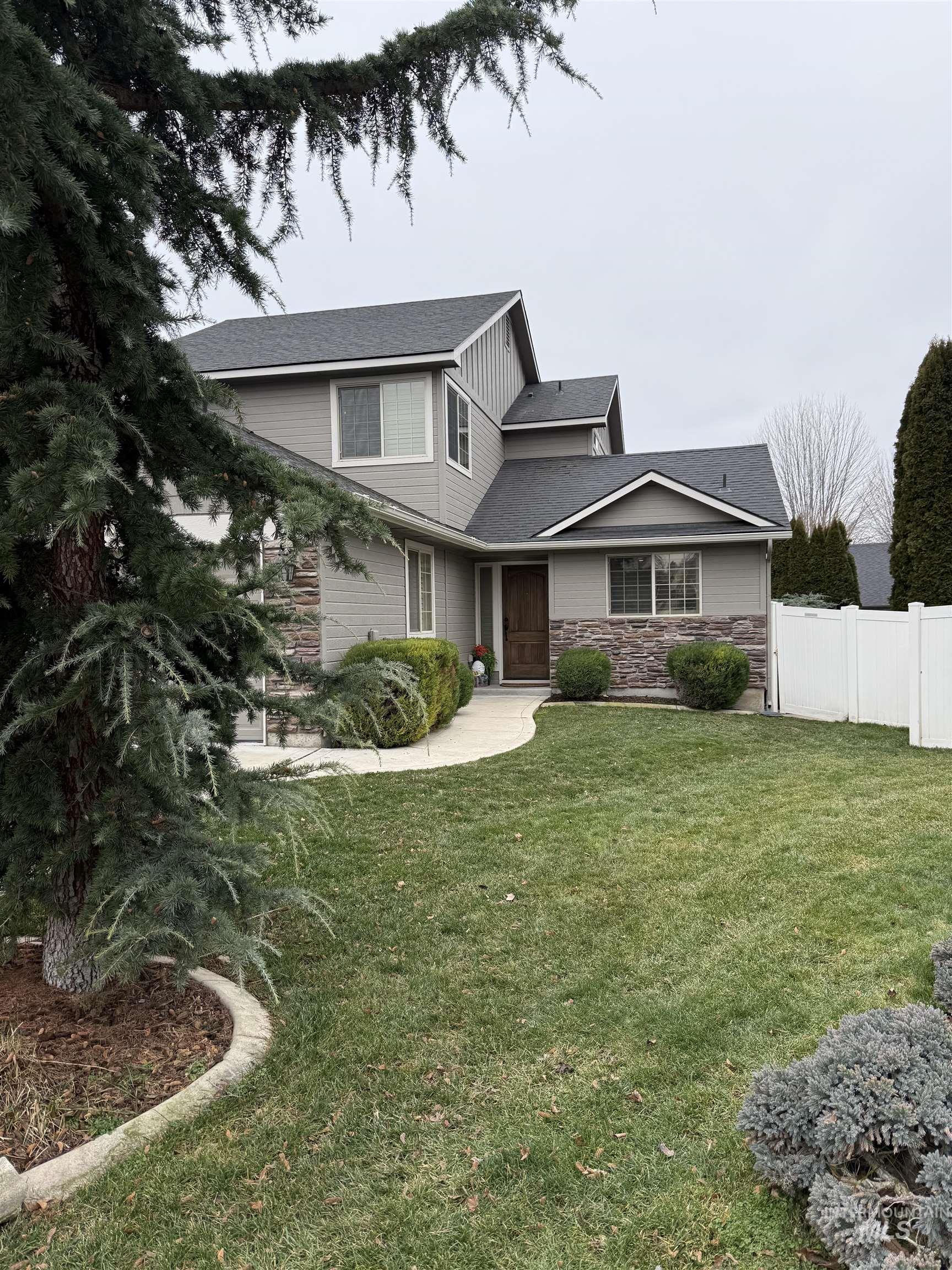 647 North Shadowfox Place Eagle, ID 83616 - Photo 1 of 1 View of front of home featuring stone siding and roof with shingles