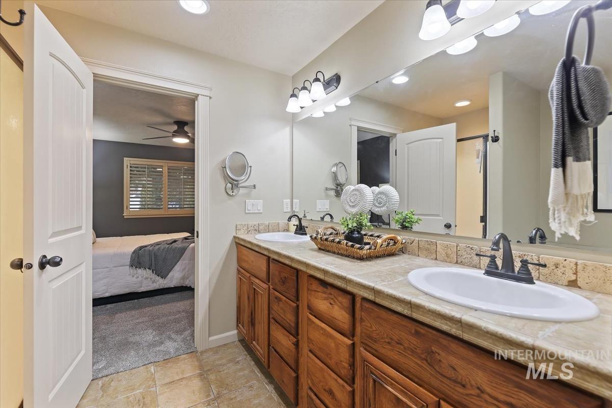 647 North Shadowfox Place Eagle, ID 83616 - Photo 19 of 35 Full bath featuring double vanity, a shower stall