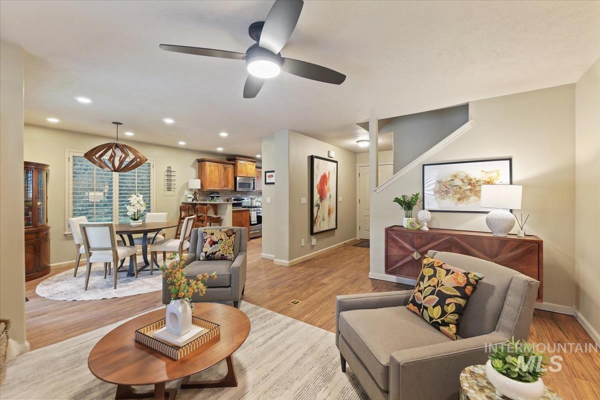 647 North Shadowfox Place Eagle, ID 83616 - Photo 5 of 35 Living room featuring LVP floors, a ceiling fan, recessed lighting