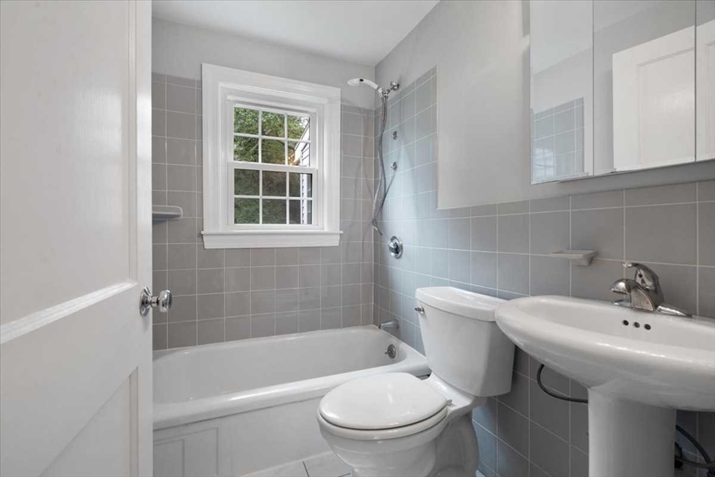 23 Marshall Road Natick, MA 01760 - Photo 14 of 31 a bathroom with a sink a toilet and shower