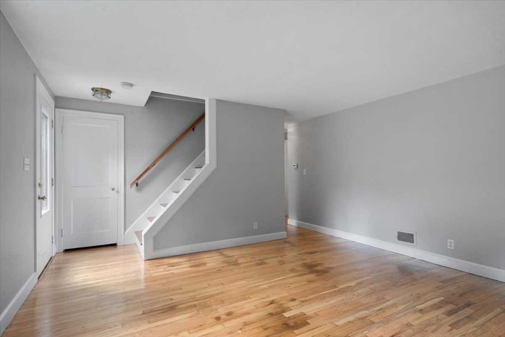 23 Marshall Road Natick, MA 01760 - Photo 17 of 31 a view of an empty room with wooden floor