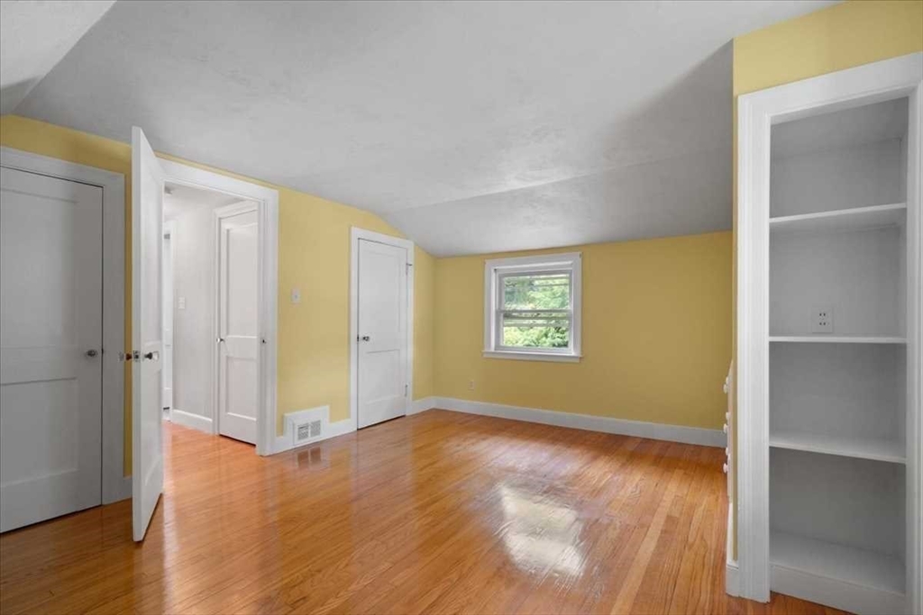 23 Marshall Road Natick, MA 01760 - Photo 19 of 31 a view of empty room with wooden floor and fan