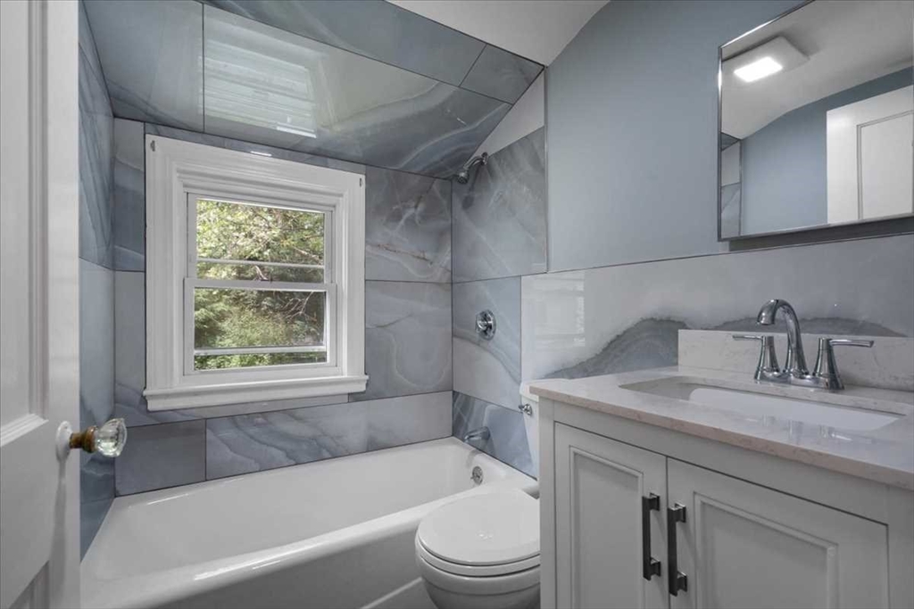 23 Marshall Road Natick, MA 01760 - Photo 21 of 31 a bathroom with a granite countertop sink toilet and bathtub
