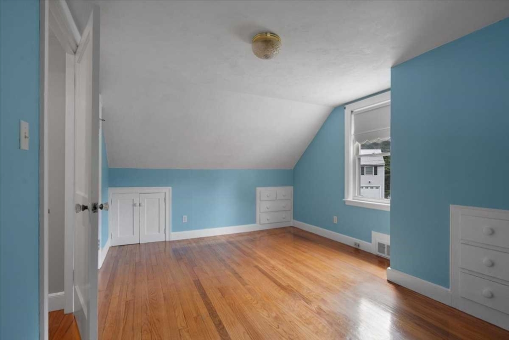 23 Marshall Road Natick, MA 01760 - Photo 23 of 31 an empty room with wooden floor and windows