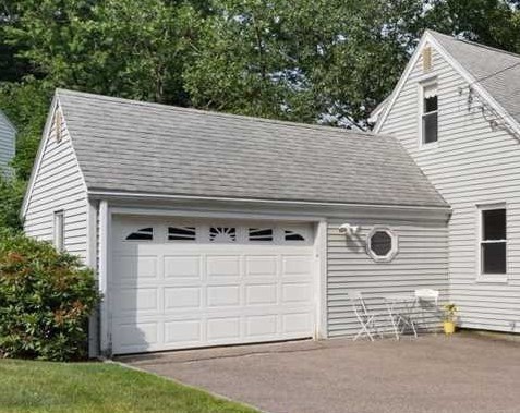 23 Marshall Road Natick, MA 01760 - Photo 25 of 31 a front view of a house with a garage