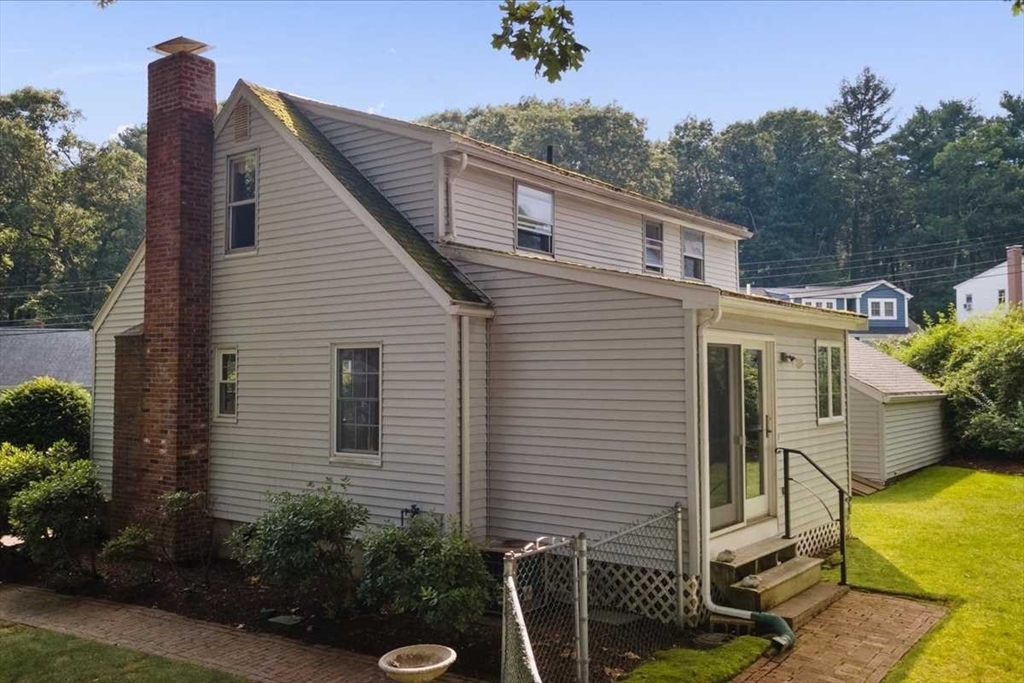 23 Marshall Road Natick, MA 01760 - Photo 26 of 31 a view of a house with a yard