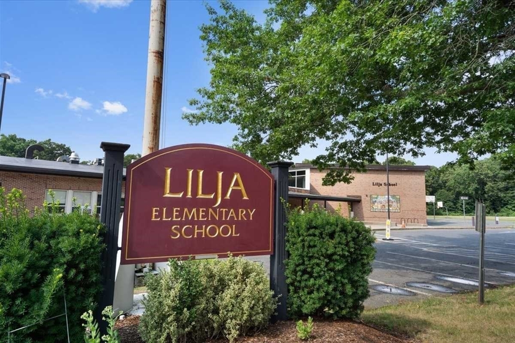 23 Marshall Road Natick, MA 01760 - Photo 30 of 31 a sign on the side of a building