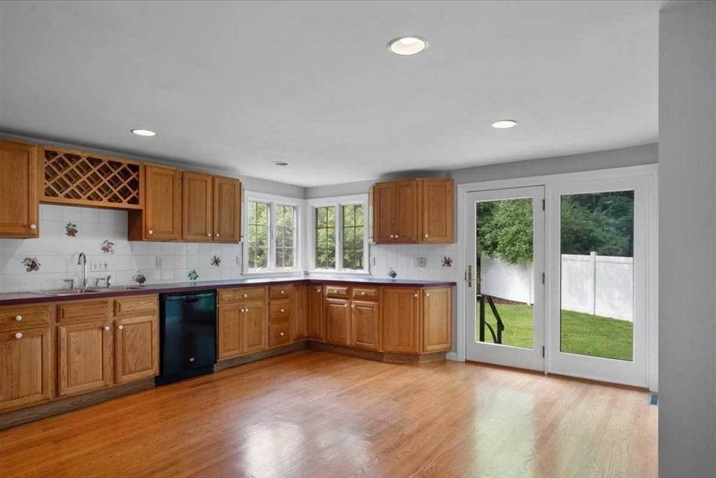 23 Marshall Road Natick, MA 01760 - Photo 7 of 31 a large kitchen with lots of counter space and a sink