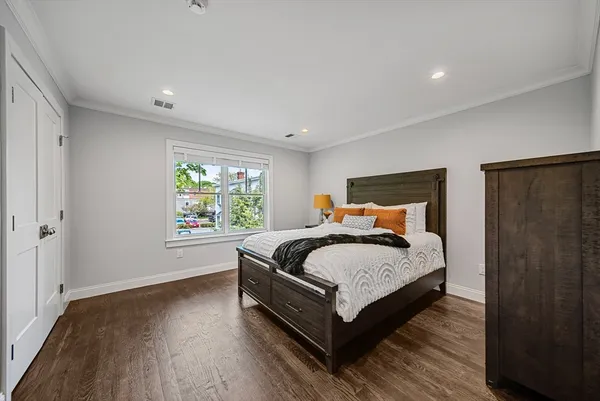 a bedroom with a bed and window