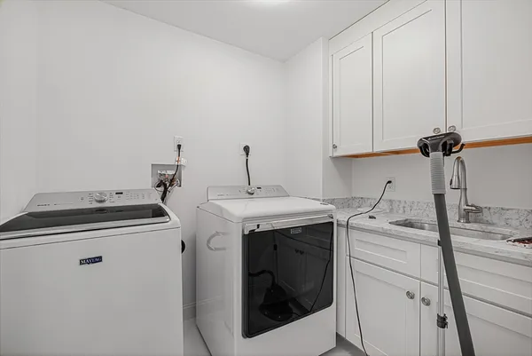 a utility room with dryer and washer