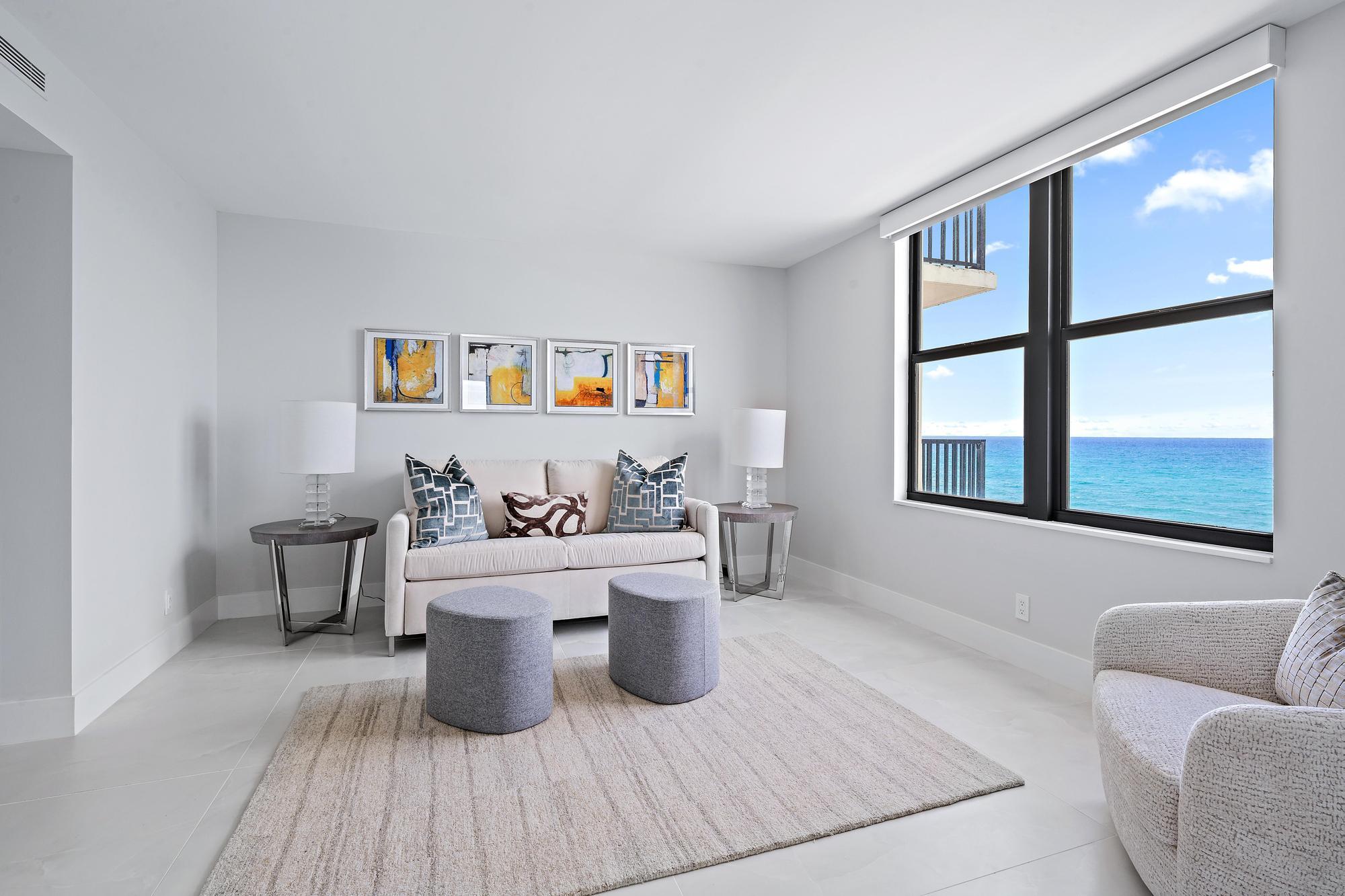 3456 South Ocean Boulevard, Unit 701 Palm Beach, FL 33480 - Photo 8 of 20 a living room with furniture and a large window