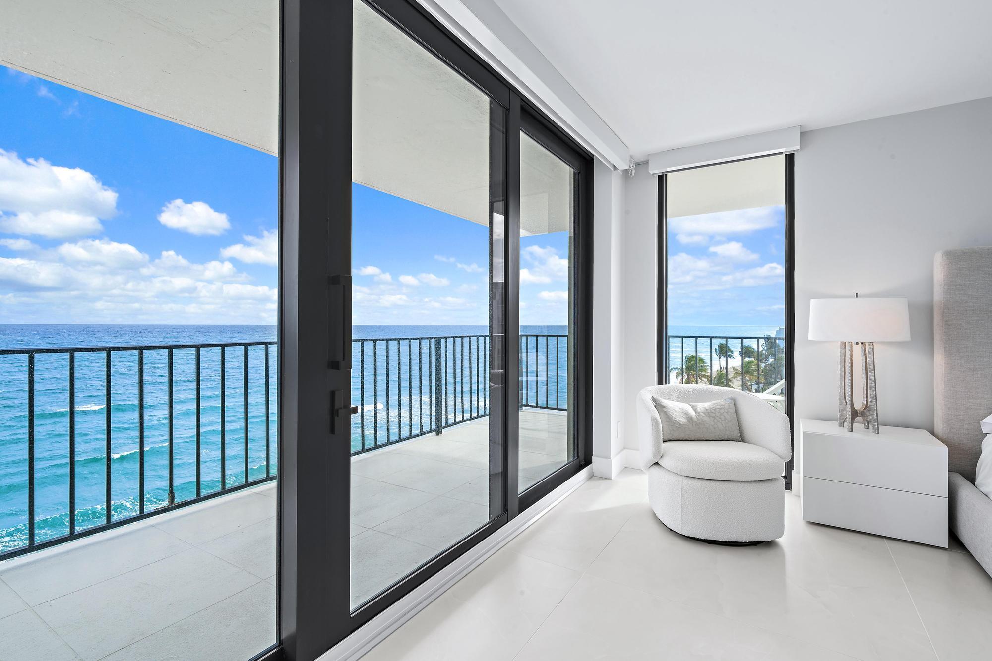3456 South Ocean Boulevard, Unit 701 Palm Beach, FL 33480 - Photo 10 of 20 a living room with furniture and a floor to ceiling window