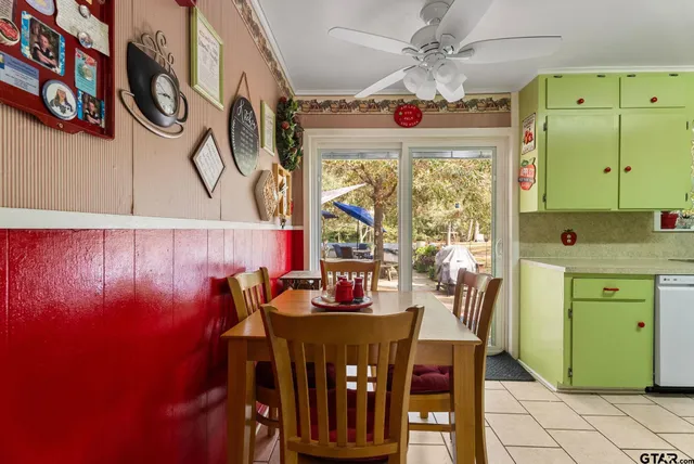 a dining room with furniture and window
