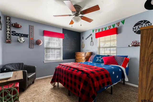 a bedroom with bed and a window