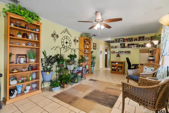a view of a livingroom with furniture and toys