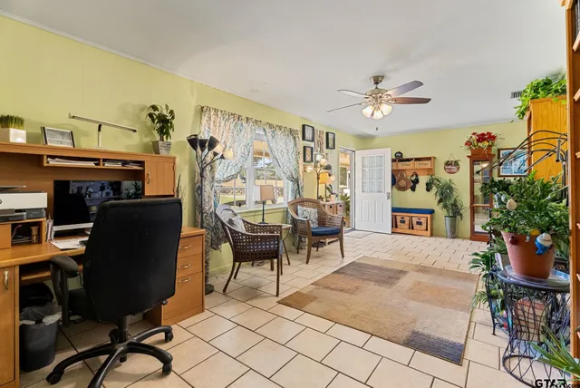 a view of a workspace with furniture and a livingroom
