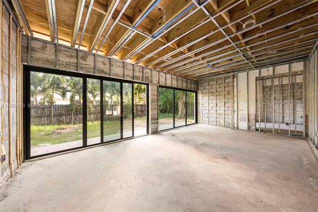 a view of an empty room with a balcony