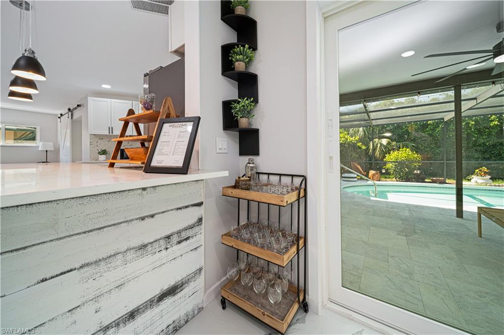 4439 Parrot Avenue Naples, FL 34104 - Photo 14 of 39 a view of an entryway with wooden floor