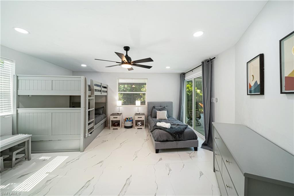 4439 Parrot Avenue Naples, FL 34104 - Photo 26 of 39 a living room with furniture and a window