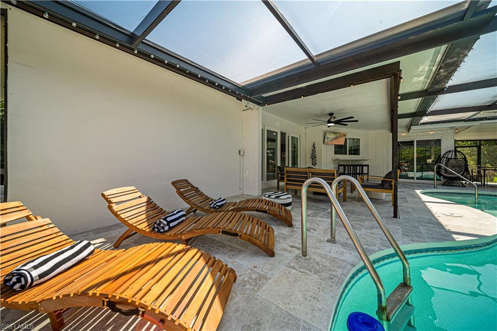 4439 Parrot Avenue Naples, FL 34104 - Photo 32 of 39 a view of a livingroom with furniture and gym equipment