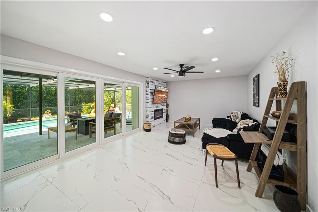 4439 Parrot Avenue Naples, FL 34104 - Photo 7 of 39 a view of a room with gym equipment